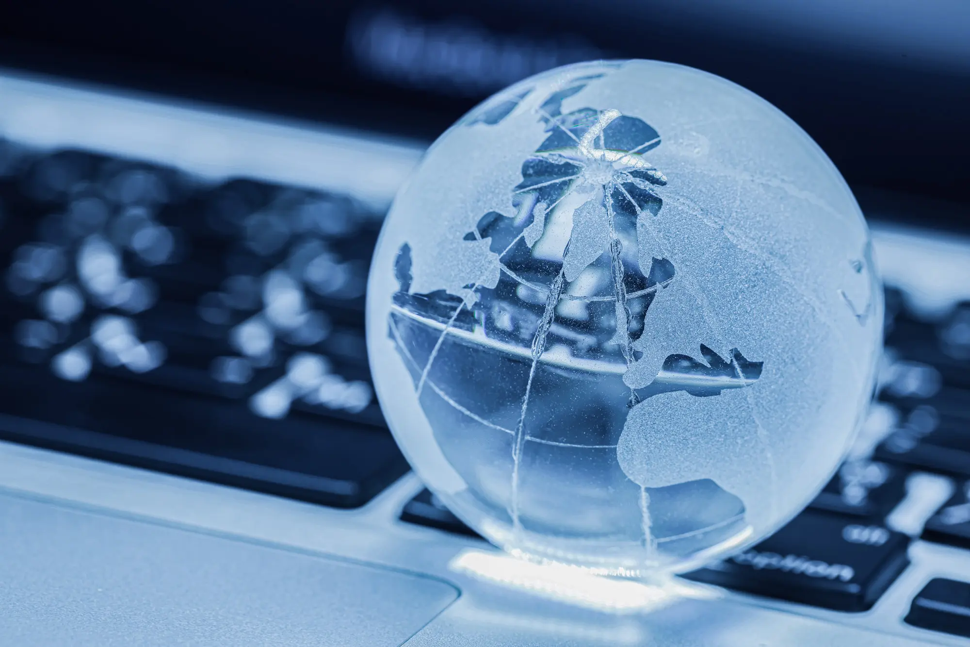 Glass globe with digital world map