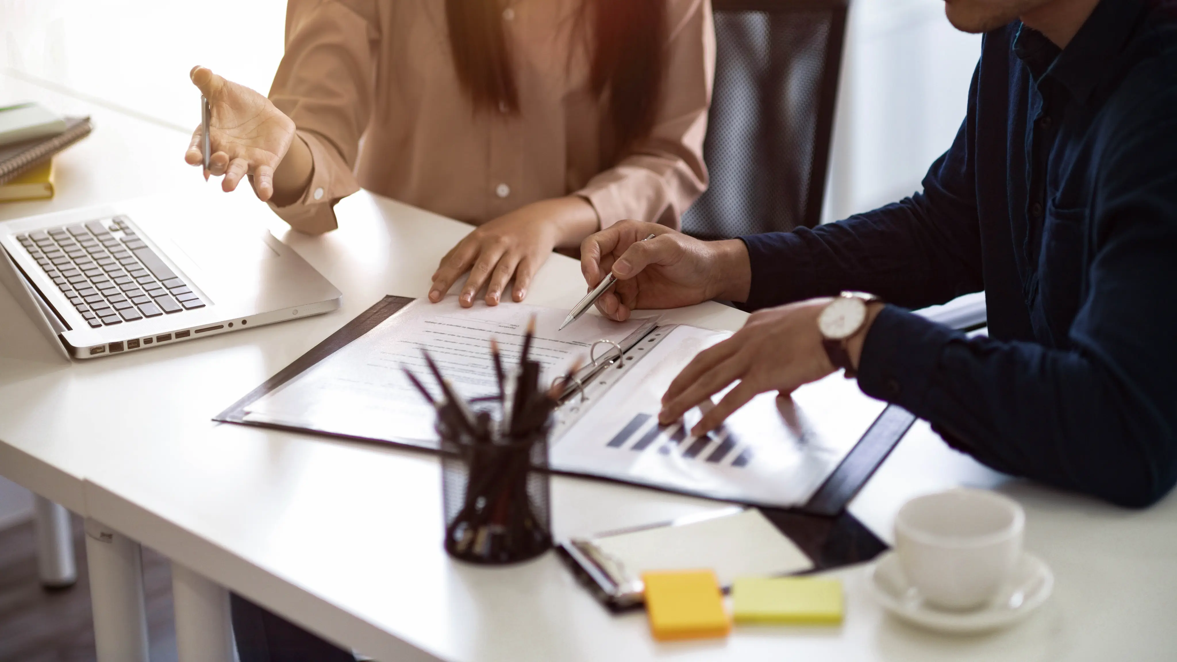 Business people discussing project at desk